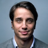Representative stock portrait, not the named author