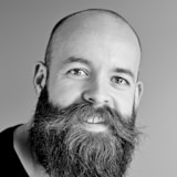 Representative stock portrait, not the named author
